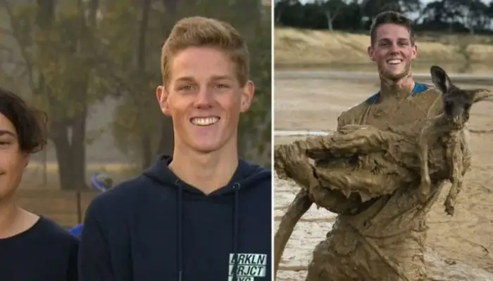 Two courageous young guys leap into a hole to save a kangaroo that has become entangled up to its neck