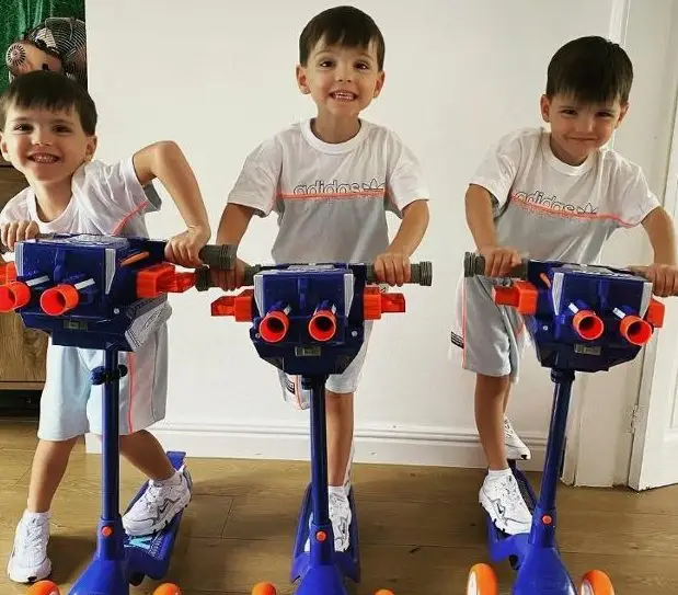 Absolutely identical triplets. They are already 7 years old: how handsome brothers grow and look