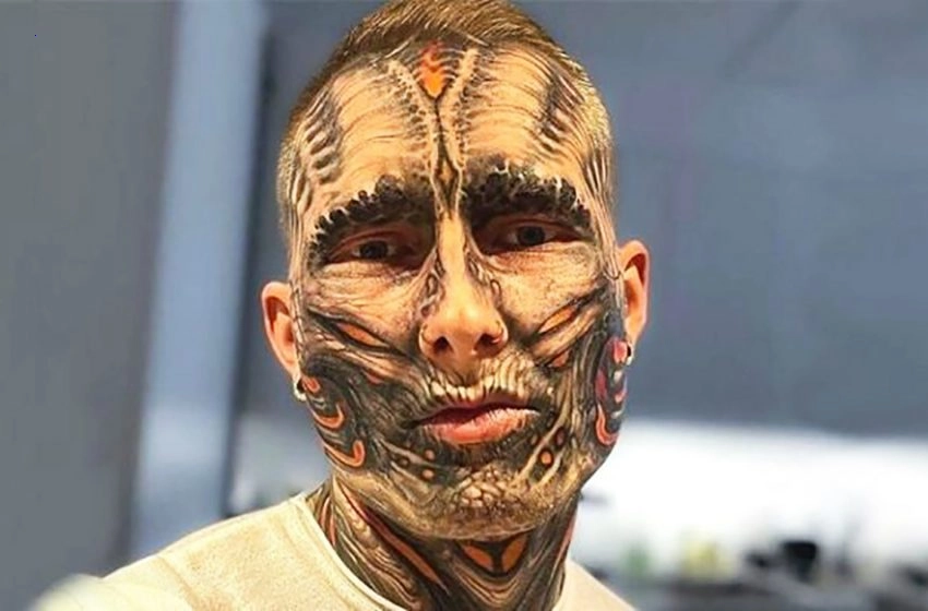 Unnaturally attractive. An American with tattoos all over his body demonstrated his appearance without them.