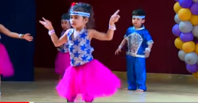 The girl dances the step in a cute and amusing way.
