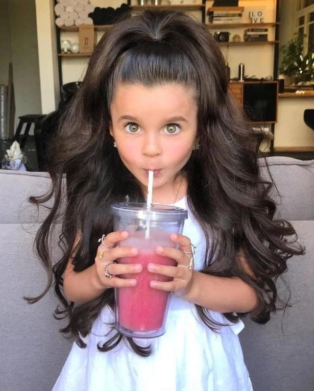 “Seven-year-old charmer blessed with beautiful hair.”