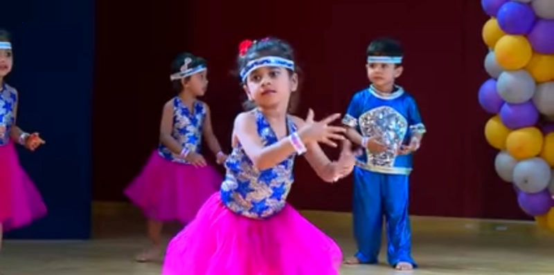 The girl dances the step in a cute and amusing way.