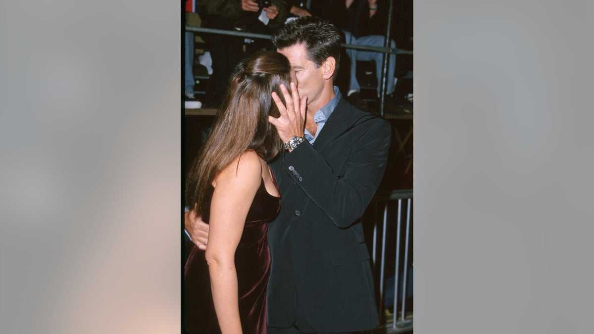 Pierce Brosnan kissing Keely Shaye Smith